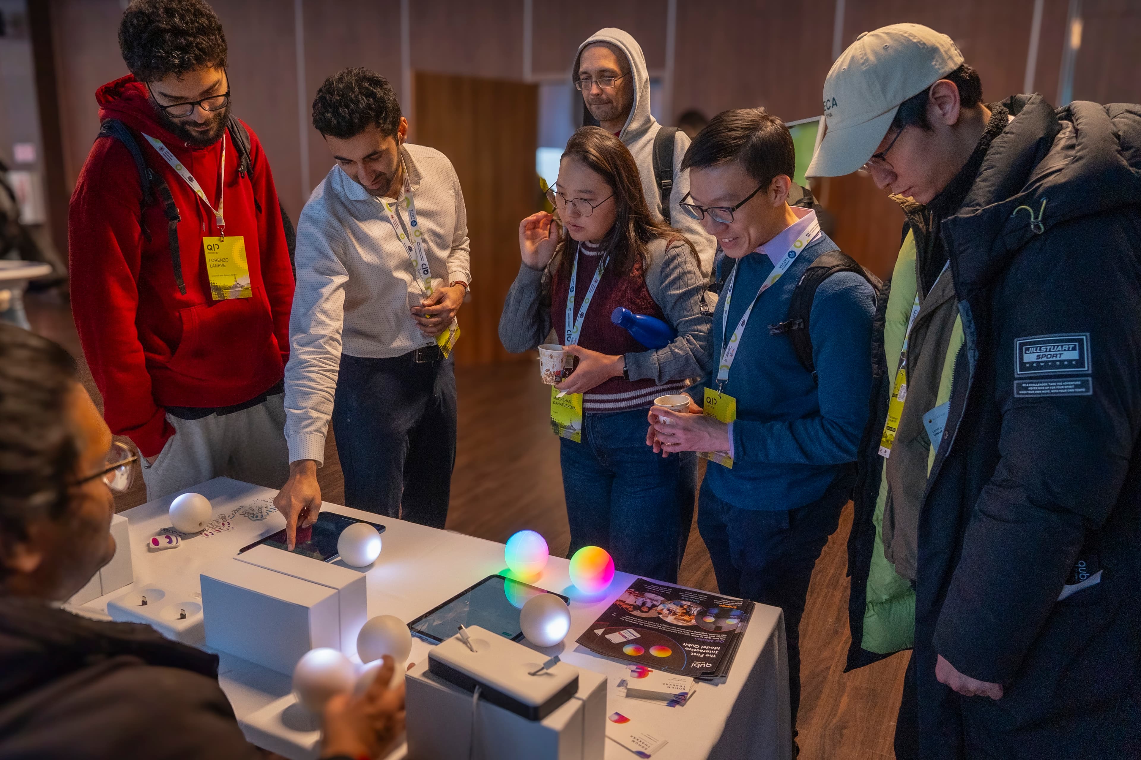 Workshop participants trying Qubis at a table