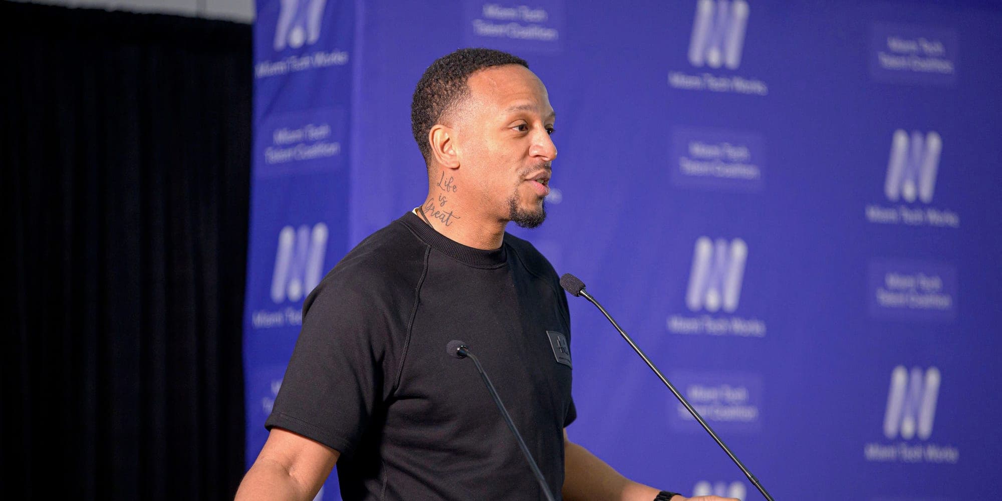Quantum Ambassador Kevin Robinson speaking at a podium