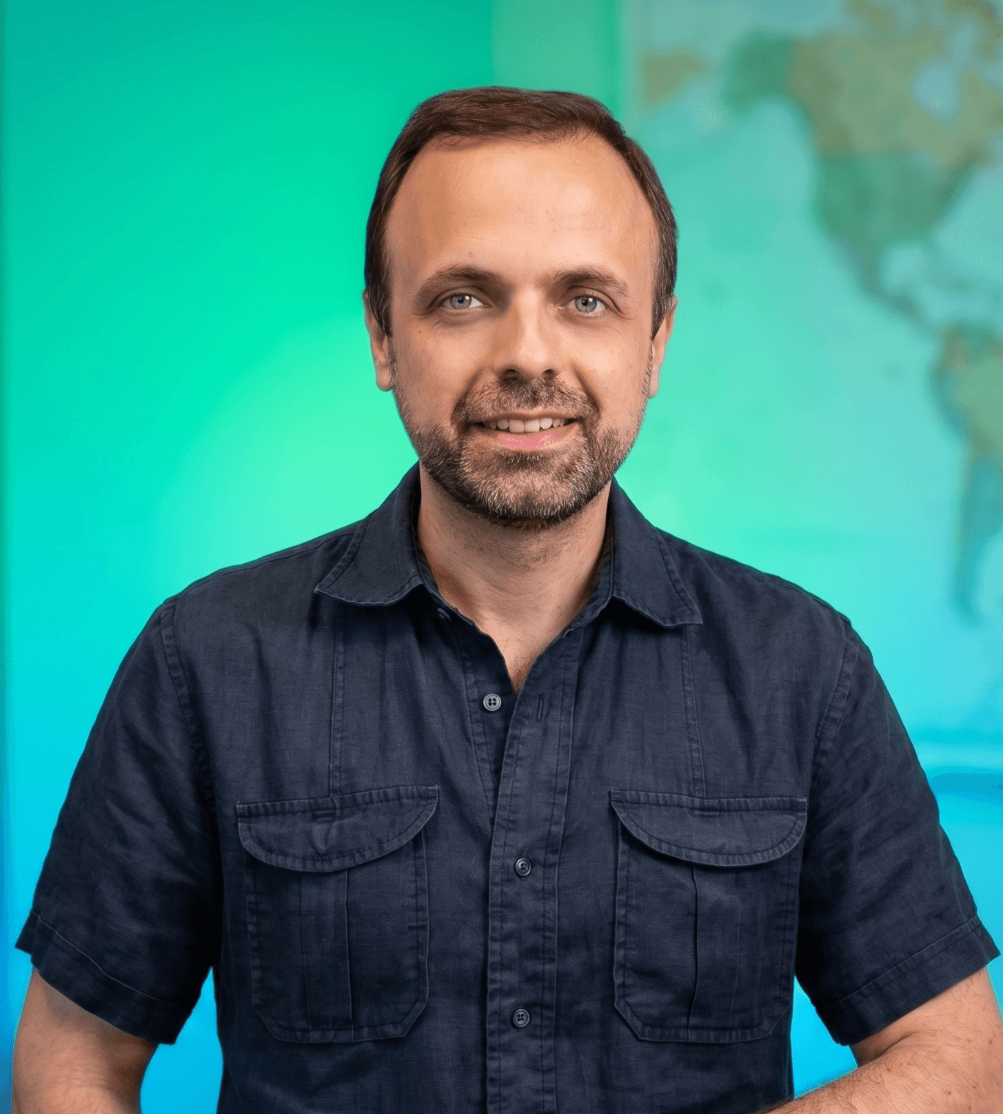 Instructor portrait in front of a world map