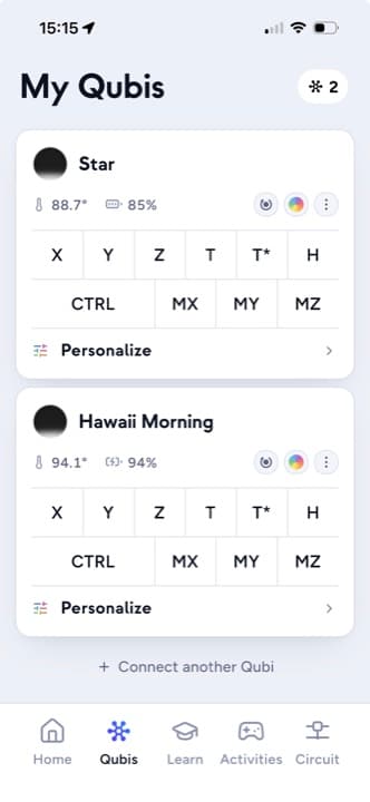The Qubi app's My Qubis page listing two connected Qubis with their battery levels and an update control